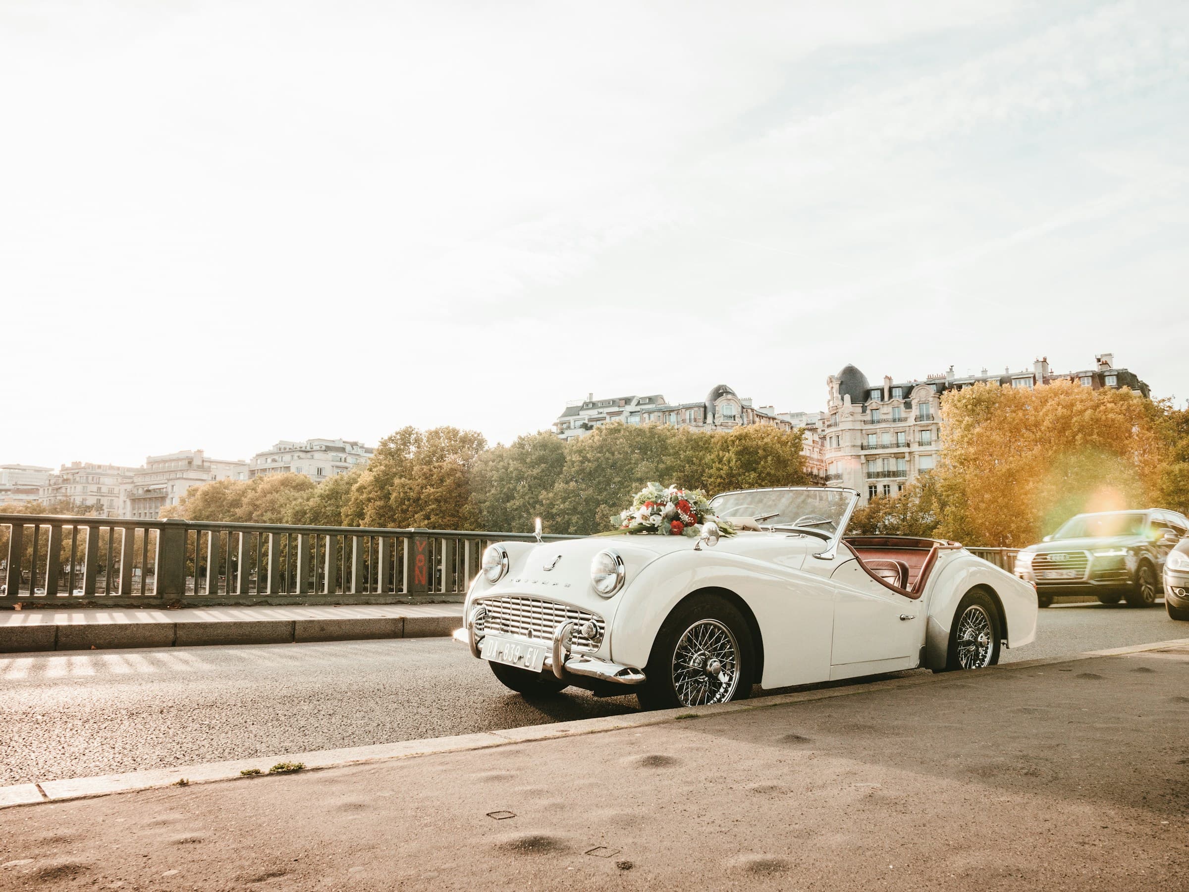 White classic car decorated with flowers