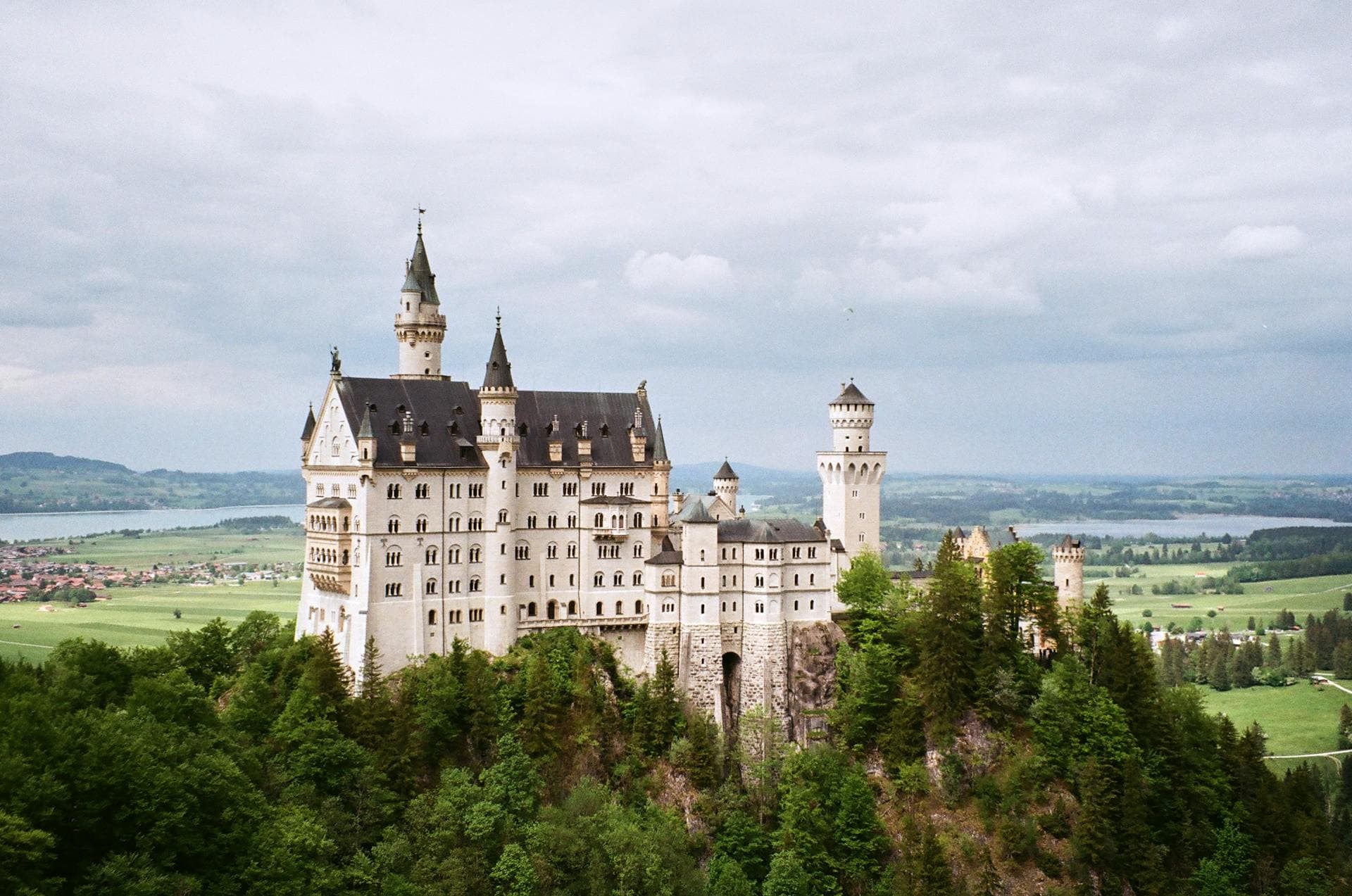 Clifftop castle wedding venue in France overlooking nearby village