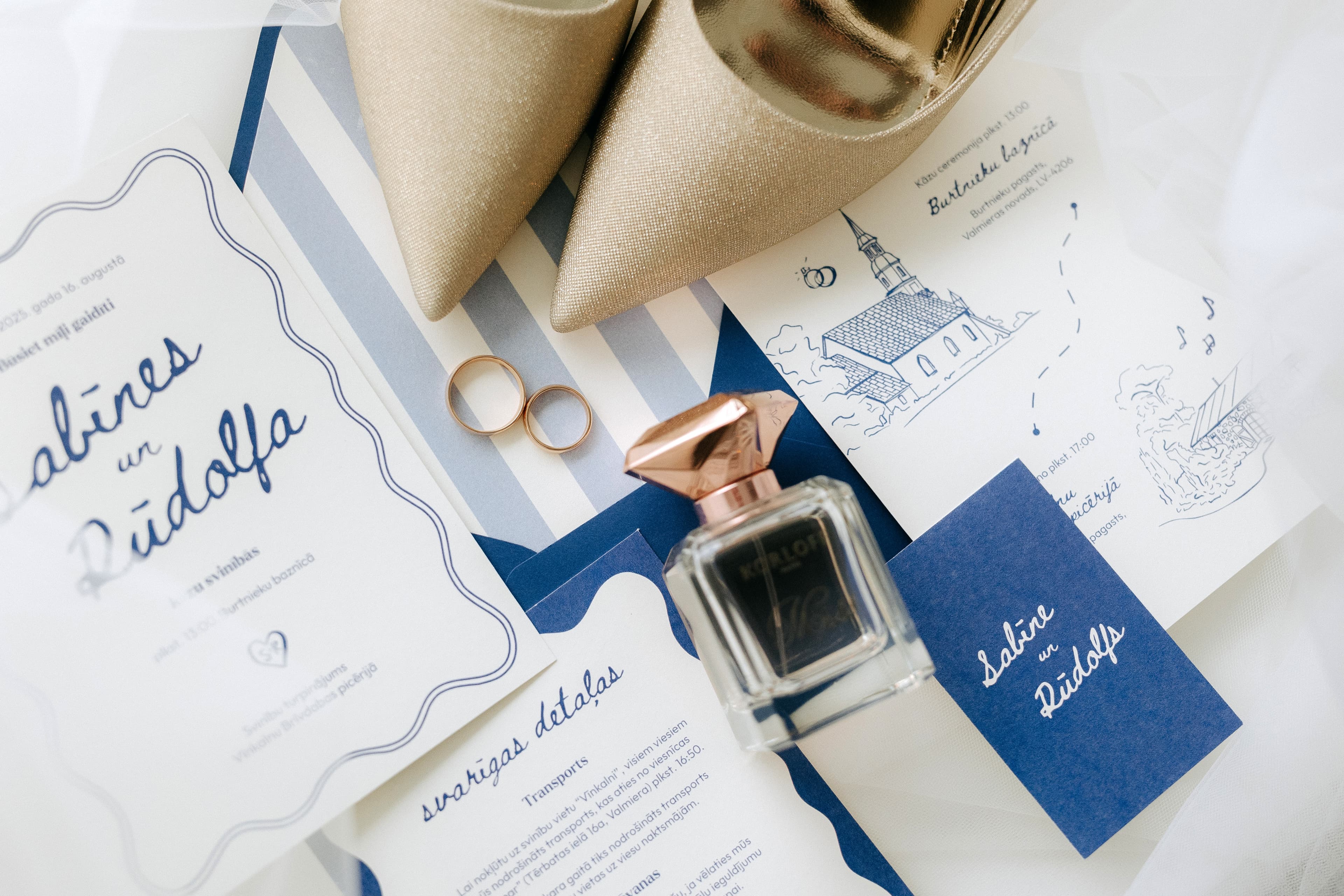 Blue and white wedding invitations with hand drawn sketch, wedding rings, and bridal heels, by designer Paldies Studio, Windsor, ON and Riga, LV